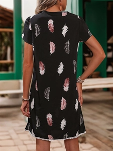 Women's summer black shift dress with feather print and white pom-pom lace hem