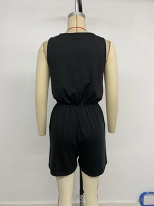 Back view of black sleeveless romper featuring elastic waist and casual loose fit design