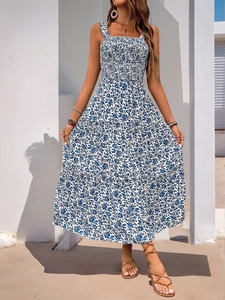 Detail of blue floral maxi dress with elastic smocked bodice and tiered bohemian skirt