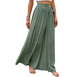 High-waisted wide leg trousers with green geometric print and waist tie-belt