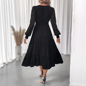 Elegant black V-neck long sleeve dress with sheer lace sleeves and tiered midi skirt