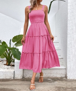 Pink summer midi dress featuring ruffled bodice and layered cake skirt detail