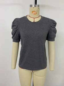 Close-up of charcoal grey T-shirt featuring stylish puff sleeves and soft cotton texture