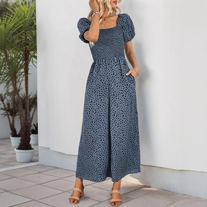 Detail of blue leopard print jumpsuit with smocked bodice and puff sleeves design
