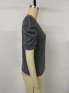 Detailed side view of deep gray T-shirt with stylish puff sleeves and round neck on mannequin