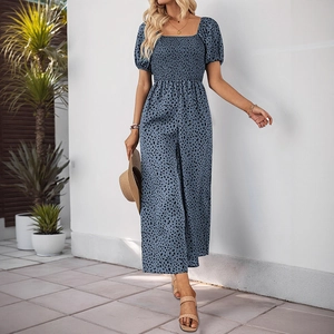 Detail of blue leopard print jumpsuit with smocked bodice and square neckline design