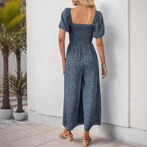 Detail view of the smocked back design on a blue leopard print short sleeve jumpsuit