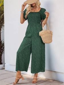 Detailed texture of green floral leopard print romper with puff sleeves and smocked bodice