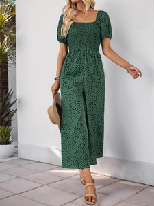 Detail of smocked square neckline and puff sleeves on a green leopard jumpsuit
