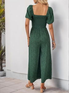 Detailed back view of a dark green leopard print smocked jumpsuit with puff sleeves