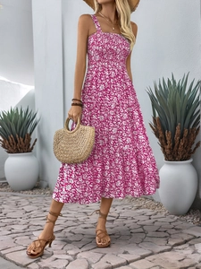 Detail of smocked chest design and white floral print on a long summer cami dress