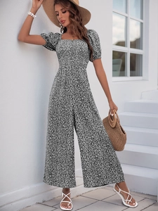 Detail of square neck and puff sleeves on a floral print jumpsuit for women