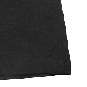 Detailed macro view of the high-waisted wide-leg pants' fine double-stitched hem and black fabric