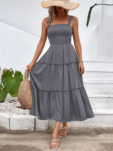 Detail of grey tiered maxi dress featuring square neck and smocked bodice for summer