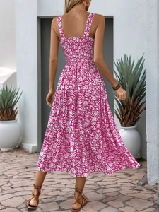 Detail of smocked back design on a tiered fuchsia floral maxi summer dress