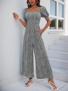 Detailed view of summer romper featuring square neck, puff sleeves and side pockets