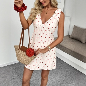 White V-neck sleeveless mini dress with red heart print and bow shoulder straps