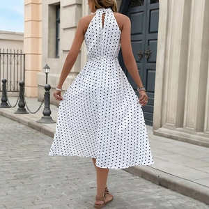 Elegant white polka dot summer halter dress with open back and elastic waist design
