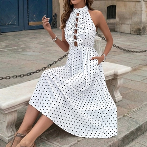 Elegant white polka dot halter maxi dress with cutout front bow and A-line skirt