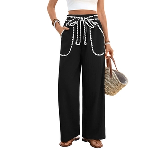 Women's high waist black wide leg trousers with white scalloped trim and drawstring