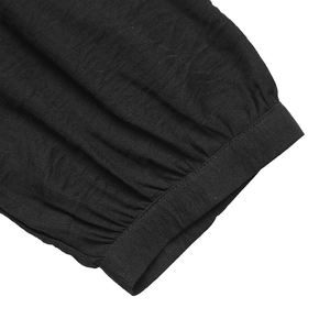 Close-up of lantern sleeve cuff and crinkle fabric texture on black ethnic dress