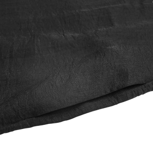 Detailed macro view of black fabric texture with fine stitching and matte finish