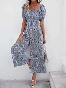 Detail of square neck and puff sleeves on floral print wide leg summer jumpsuit