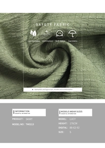 Detailed view of grass green skirt fabric with vertical pleats and durable texture