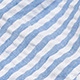 Detail shot of blue and white striped seersucker fabric with a wrinkled texture