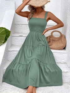 Detail of smocked bodice and tiered maxi dress in sage green for summer beach vacation