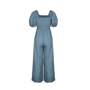 Detail of blue floral jumpsuit featuring square neck and elastic smocked bodice texture