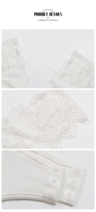 Detailed view of white lace trim and secure bottom snap closure on the bodysuit