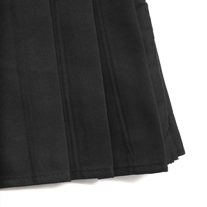 Detailed close-up showing the precise stitching and neat pleats of the black Y2K pleated skirt