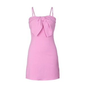 Pink backless mini dress with large bow accent and adjustable spaghetti straps