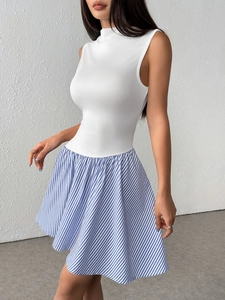 Close-up of sleeveless mock neck dress with striped A-line skirt and slim fit design