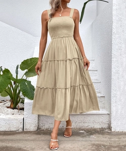 Detail of square neckline and tiered smocked khaki sun dress for casual vacation