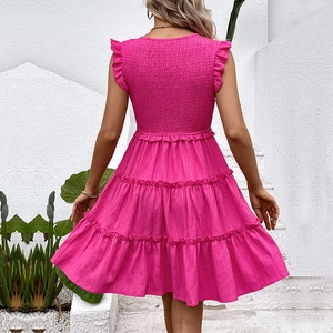 Hot pink tiered summer dress with smocking detail and ruffle sleeves back view