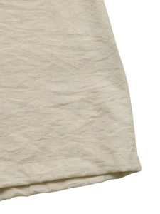 Detailed macro view of the breathable beige cotton-linen fabric with fine stitching