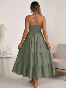 Sage green halter backless maxi dress with smocked waist and layered tiered skirt
