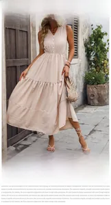 Detail of V-neck sleeveless maxi dress with textured fabric and decorative buttons