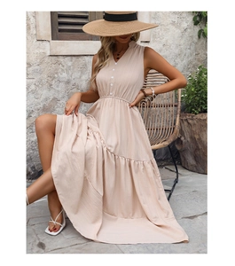 Detail of summer beige V-neck sleeveless maxi dress with textured crepe fabric and buttons