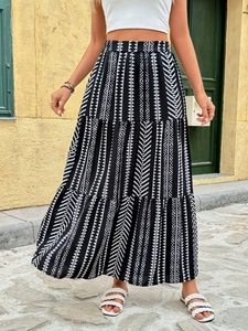 Detail view of Bohemian geometric print tiered skirt with breathable woven fabric layers
