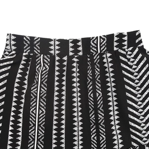 Detail shot of black and white geometric tribal print on high waist maxi skirt fabric