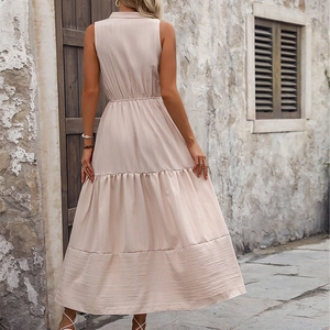 Sleeveless tiered maxi dress with V-neck and textured fabric in back-view outdoor shot