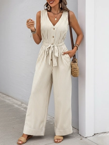 Detail of V-neck sleeveless striped jumpsuit with front buttons and matching waist belt