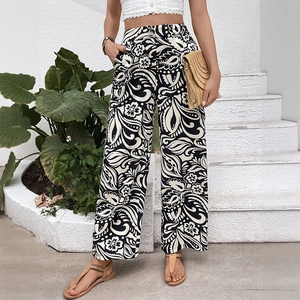 Women's high waist wide leg pants with black and white tropical floral print