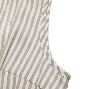 Macro shot of vertical striped fabric detailing the armhole and fine sewing quality