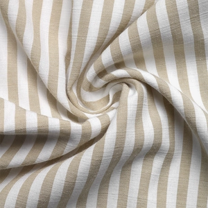 Macro shot of striped cotton linen fabric showing natural texture and soft drape