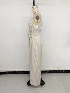 Detail view of khaki vertical stripes on sleeveless jumpsuit with matching fabric waist tie