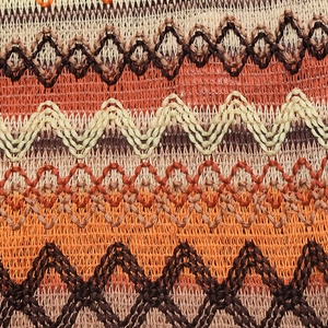 Détail de tissu tissé géométrique bohème avec des motifs de franges ethniques